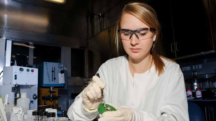 female scientist with petri dish